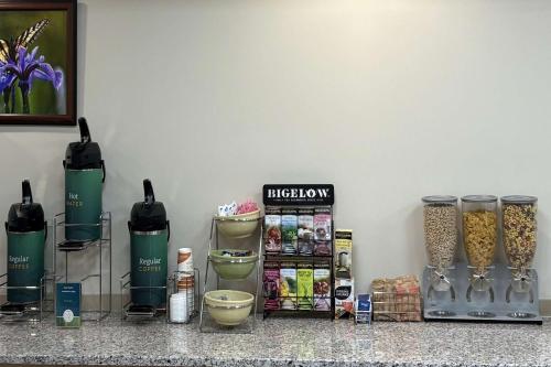 a counter top with some food and other items at Quality Inn & Conference Centre Downtown Sudbury in Sudbury