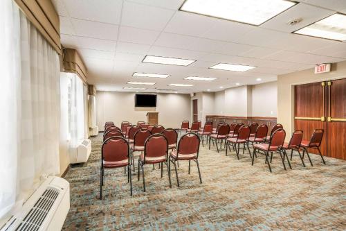 a conference room with a bunch of chairs in it at Sleep Inn & Suites Jacksonville near Camp Lejeune in Jacksonville