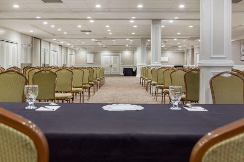 a conference room with a table and chairs at Radisson Hotel Southfield-Detroit in Southfield