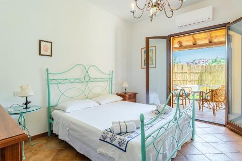 Postel nebo postele na pokoji v ubytování Casa Airin, Villasimius center