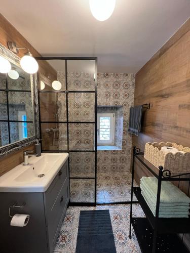 a bathroom with a sink and a shower at Vila More moje A2 in Vis