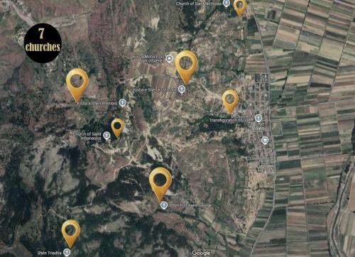 a map with yellow pointers on a city at Voyage House in the countryside Polen in Korçë