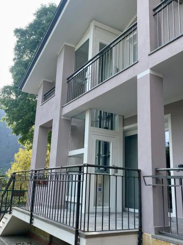 an apartment building with balconies on the side at Bed & Breakfast L'Albero Maestro in Borgofranco dʼIvrea