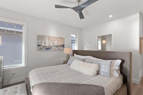 a bedroom with a bed with a ceiling fan at 165 - 2450 Radio Tower Rd-Jacobson in Osoyoos