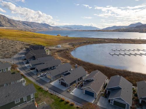 an aerial view of a house next to a body of water at 165 - 2450 Radio Tower Rd-Jacobson in Osoyoos
