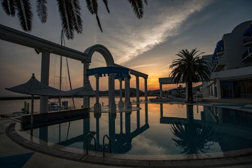 a swimming pool with a water slide in a resort at Hotel Limani in Setouchi