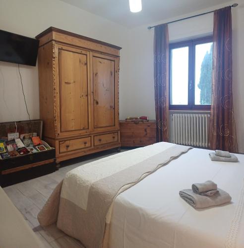 Ένα ή περισσότερα κρεβάτια σε δωμάτιο στο Casa di Tea costa etrusca piombino