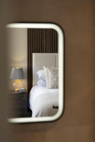 Ένα ή περισσότερα κρεβάτια σε δωμάτιο στο Kings Road Suites