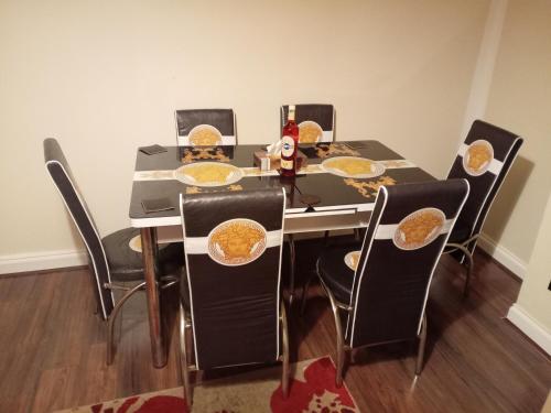 a dining room table with plates of food on it at Kaffuhsmartt in Drumchapel