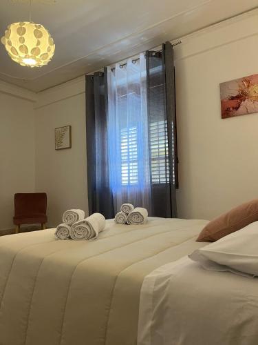 Ένα ή περισσότερα κρεβάτια σε δωμάτιο στο Maresia Apartment