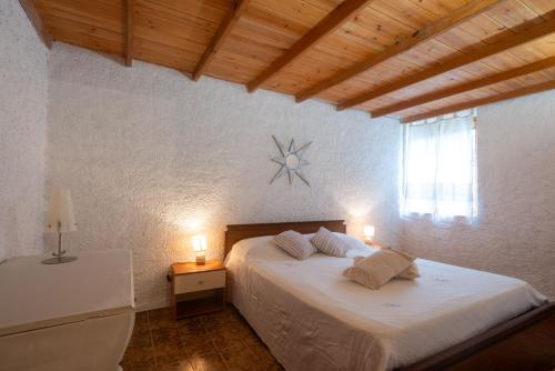 Postel nebo postele na pokoji v ubytování Rustico Gallurese