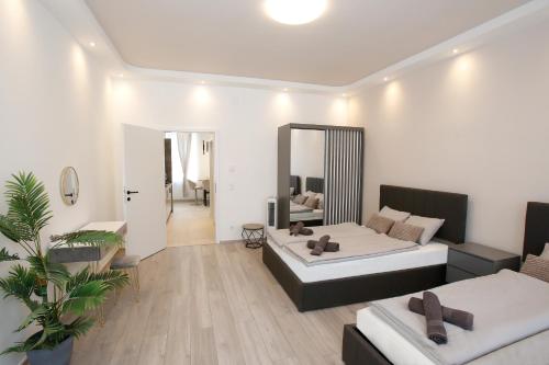 a living room with a bed and a mirror at LUX Prime Suite Vienna with FREE parking and FAST Internet 600 MBits in Vienna