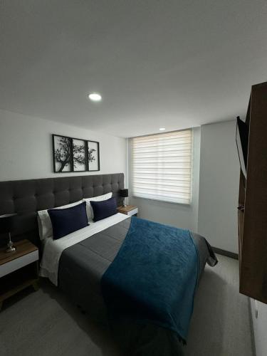 Ένα ή περισσότερα κρεβάτια σε δωμάτιο στο Magnifico y Confortable Apartamento Amoblado