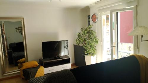 a living room with a tv and a couch at Home St Nicolas Home VUT42/000161 in Soria
