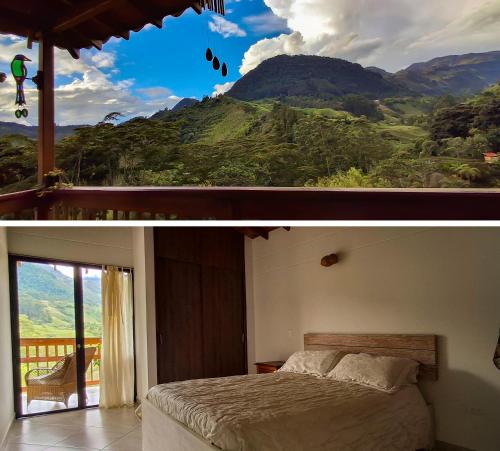 a bedroom with a view of a mountain at La Casa Del Sol in Jardin