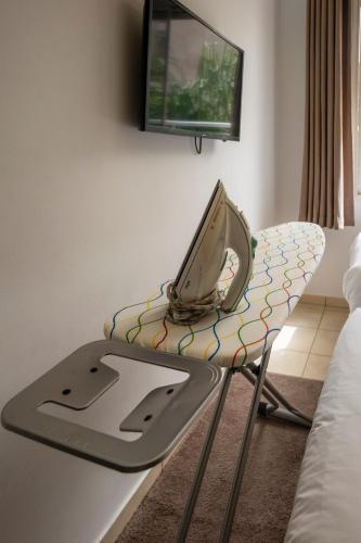 a laptop computer sitting on a chair in a room at Chic & Cozy Retreat in Agadir in Agadir
