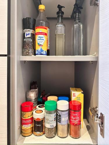 a pantry filled with lots of different types of food at 80qm Luxus Apartment mit großer Terrasse in Saarbrücken