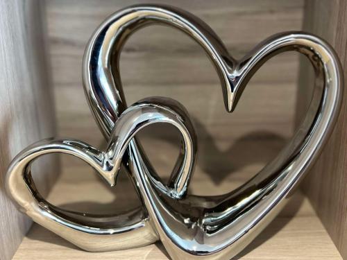 a heart shaped metal object sitting on a table at Edinburgh, Seton Sands, The Fishing Boat in Port Seton