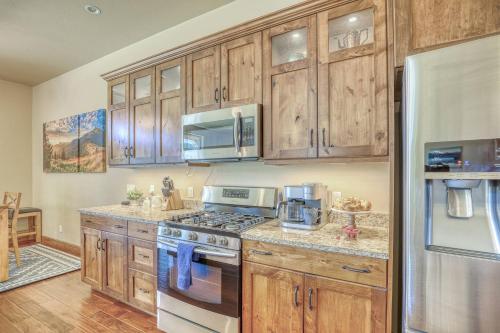 a kitchen with wooden cabinets and a stove top oven at 10 Cobblestone Ln in Pagosa Springs