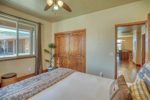 a bedroom with a bed and a window at 10 Cobblestone Ln in Pagosa Springs
