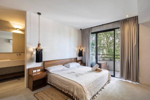 Postel nebo postele na pokoji v ubytování Soko Tulum