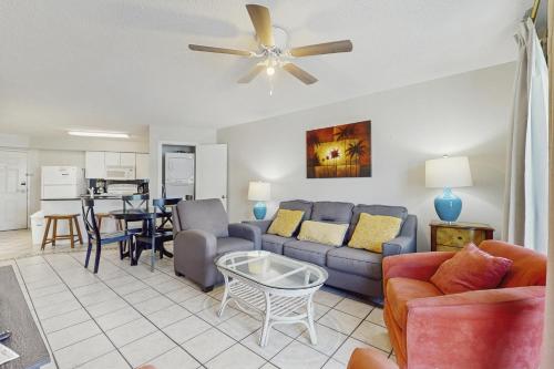 a living room with a couch and a table at Harbour Place 506 in Gulf Shores