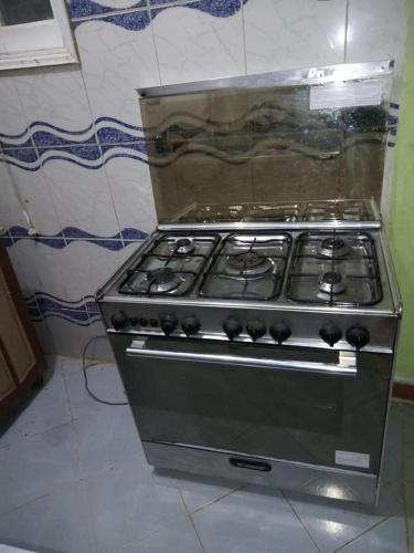 a stove top oven sitting in a kitchen at Large and cheerful home with 2 floors in Fayoum Center
