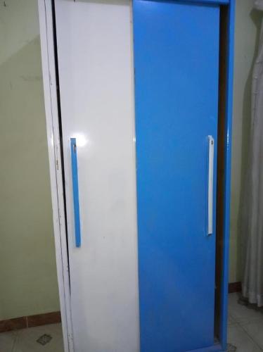 a blue and white elevator in a room at Large and cheerful home with 2 floors in Fayoum Center