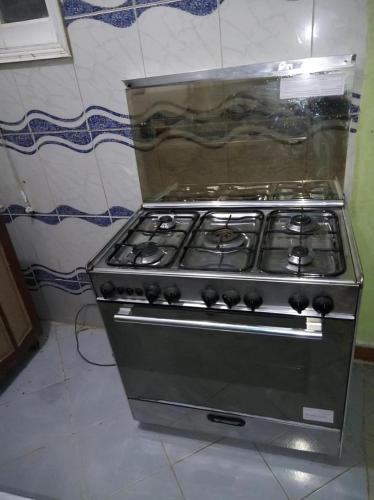 a stove top oven sitting in a kitchen at Large and cheerful home with 2 floors in Fayoum Center