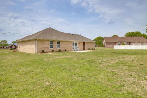 a house in a yard with a grass field at Patio and Spacious Yard Home in Athens in Harvest