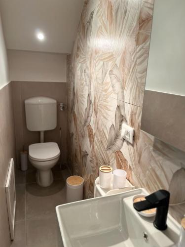 Koupelna v ubytování Helios Apartaments