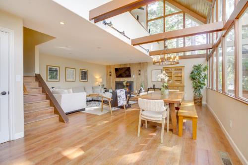 a dining room and living room with a table and chairs at Walk to Lake Arrowhead Village Gem with Lake Access in Lake Arrowhead