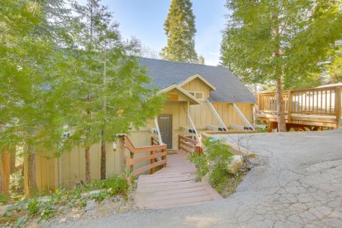 a house with a porch and a deck at Walk to Lake Arrowhead Village Gem with Lake Access in Lake Arrowhead
