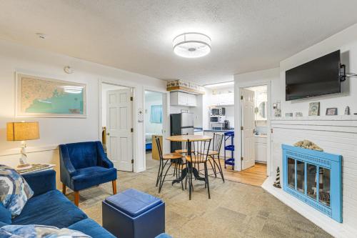 a living room with a blue couch and a table at Walk to Ocean and Pier Prime OOB Condo! in Old Orchard Beach