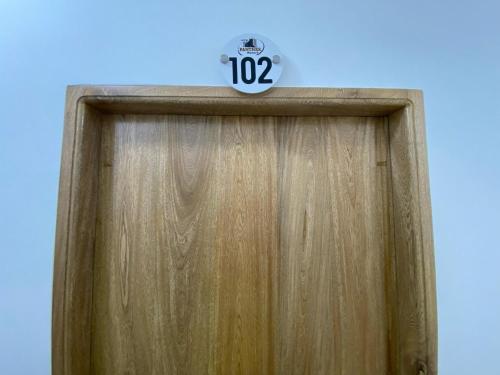 a wooden door with a clock on top of it at Hotel Panther Resort in Necoclí