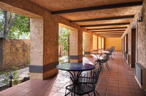 a row of tables and chairs on a patio at Hotel Zico, BW Signature Collection in Mountain View