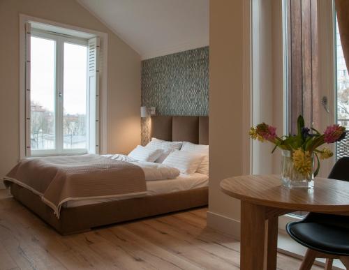 מיטה או מיטות בחדר ב-Baltica Residence