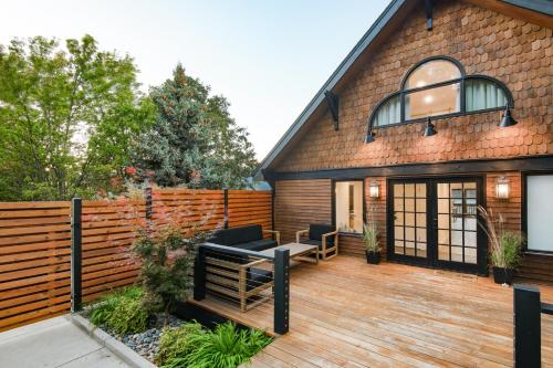 a house with a wooden deck with a fence at Horsefeathers Hotel in Hood River
