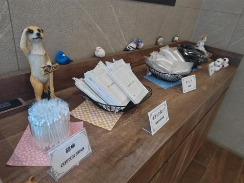 a counter with a dog figurine on top of it at Rembrandt Style Sapporo in Sapporo