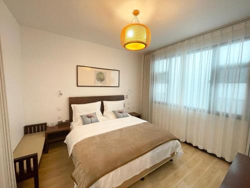 Dali Yanyuan Mountain Retreatにあるベッド
