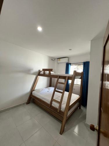 Ένα ή περισσότερα κρεβάτια σε δωμάτιο στο Apartamentos Mila