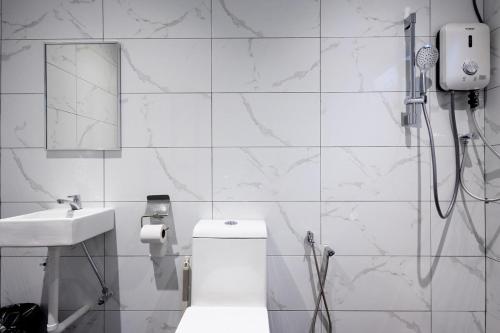 a bathroom with a shower and a toilet and a sink at Casa Bella - Private Studio Ipoh - Pet allowed in Ipoh