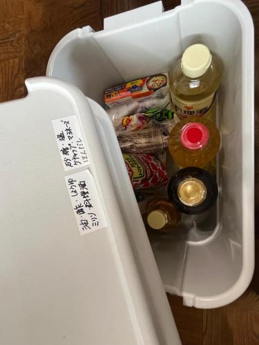 an open refrigerator filled with food and drinks at ぶどう畑に囲まれた貸切宿 バーベキュー可能 白百合醸造から徒歩すぐ"Vineyard Vista" Vacation rental BBQ permitted short walk from Winery in Yamanashi