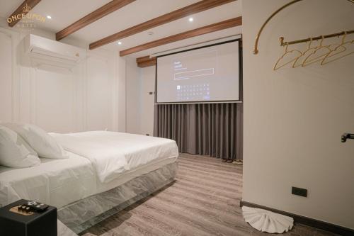 Ένα ή περισσότερα κρεβάτια σε δωμάτιο στο Once Upon a Hotel Pattaya