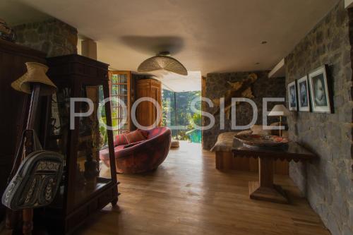 a living room with a couch and a table at Rumah Lereng Bandung in Bandung