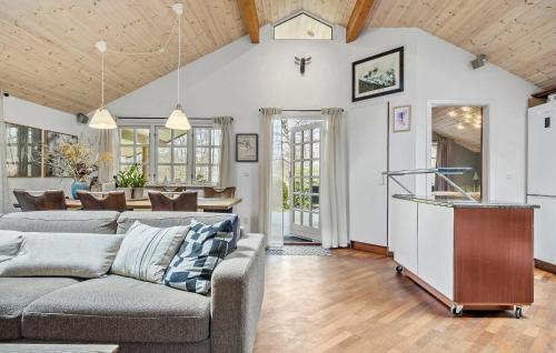 a living room with a couch and a table at Lovely Home In Gørlev With Wifi in Gørlev