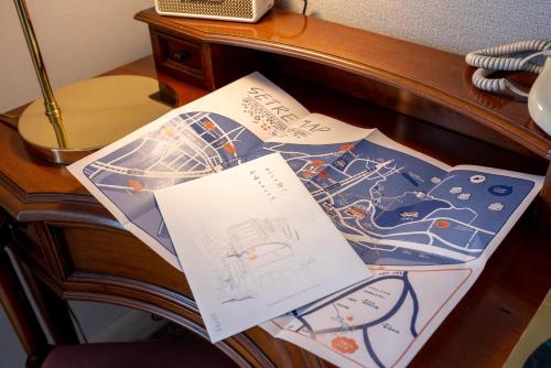 a pile of papers sitting on top of a desk at Setre Glover's House Nagasaki in Nagasaki