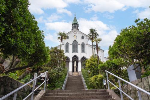 a church with stairs leading up to it at Setre Glover's House Nagasaki in Nagasaki