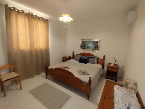 a bedroom with a bed and a chair in it at Sea Breeze Bliss - Self Check-in in St Paul's Bay