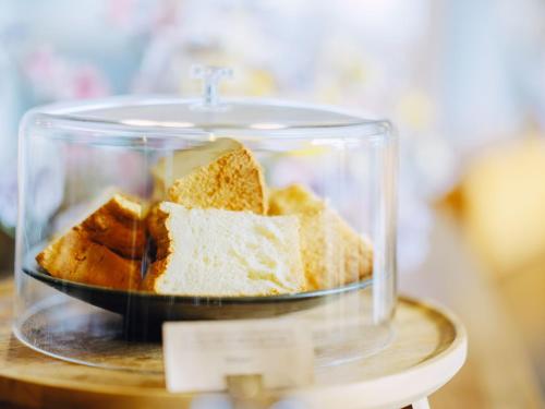 a glass container filled with different types of bread at HIKE in Tamana